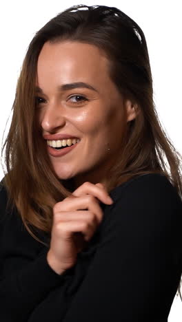shot of female model. portrait of friendly woman smiling on isolated white background. vertical video