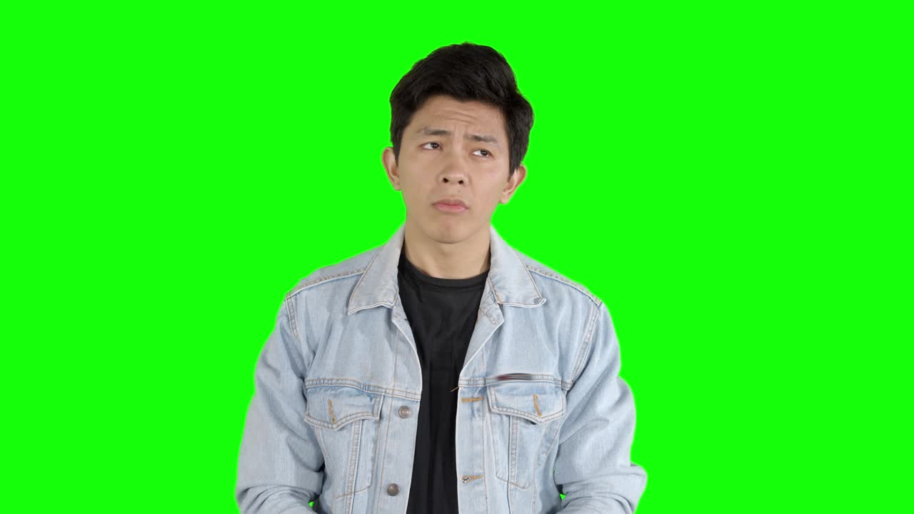 Man looks unsure and shrugging his shoulders