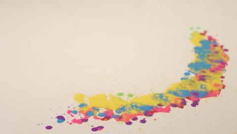 varios colores de pinturas de aceite están goteando sobre el papel blanco.