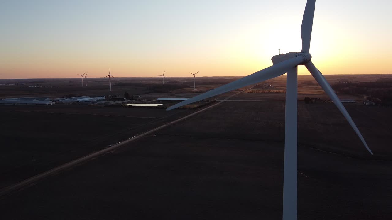 Michigan Wind Farm In Ubly, Michigan With A Fiery Sunset Behind.-closeup shot