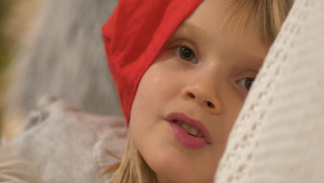 Joyful-young-little-Girl-with-red-hat-smiling-happily,-Close-up