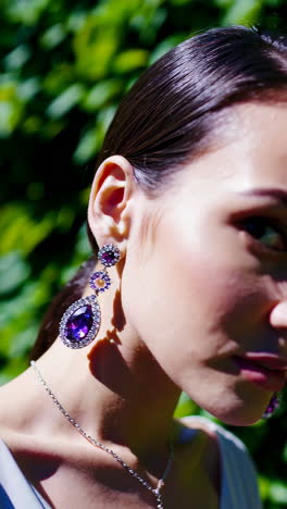 elegant woman wearing purple gemstone jewelry