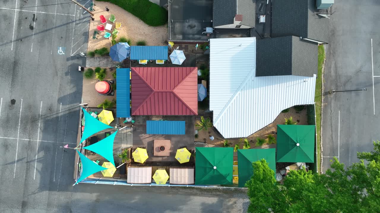 Top down aerial of outdoor restaurant, tiki bar