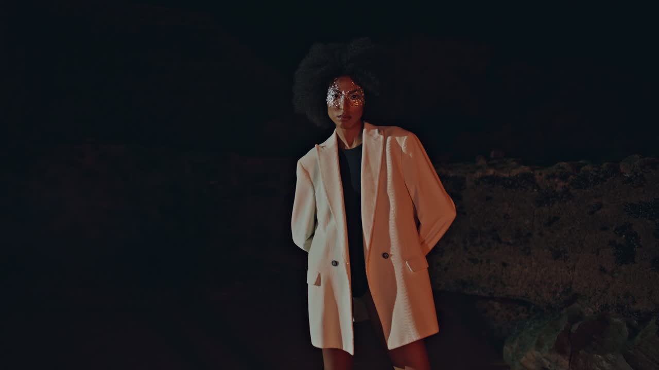 Stylish model posing beach in white jacket. Sexy lady with silver party makeup