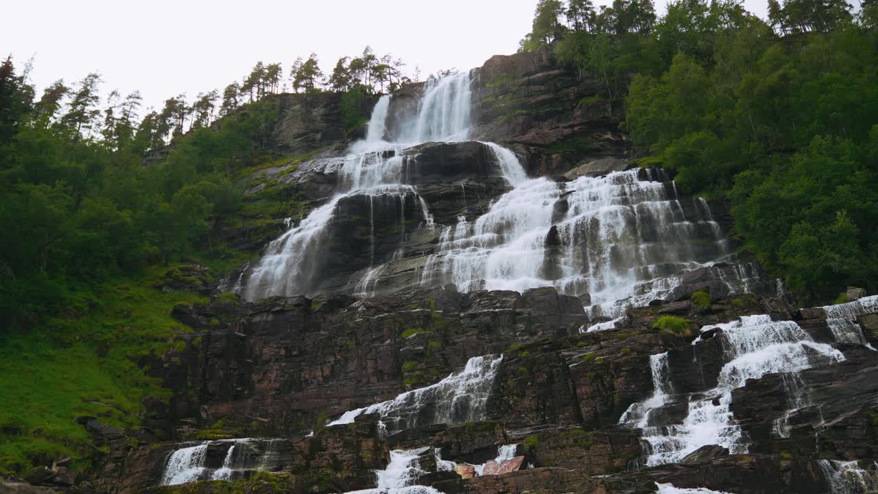 Tvindefossen Waterfall in Norway. Scenic cascade in Scandinavia. Landscape river nature. Natural phenomenon.