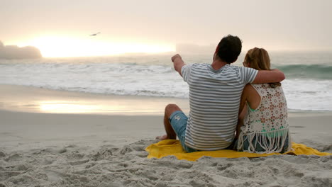 couple sitting on the beach