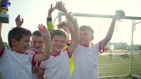 young soccer team celebrating a victory