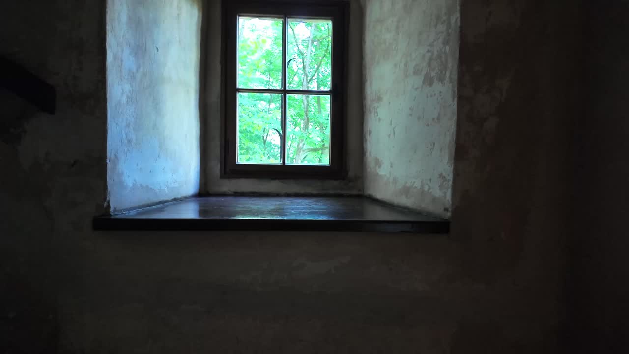 Looking out the window in the castle room