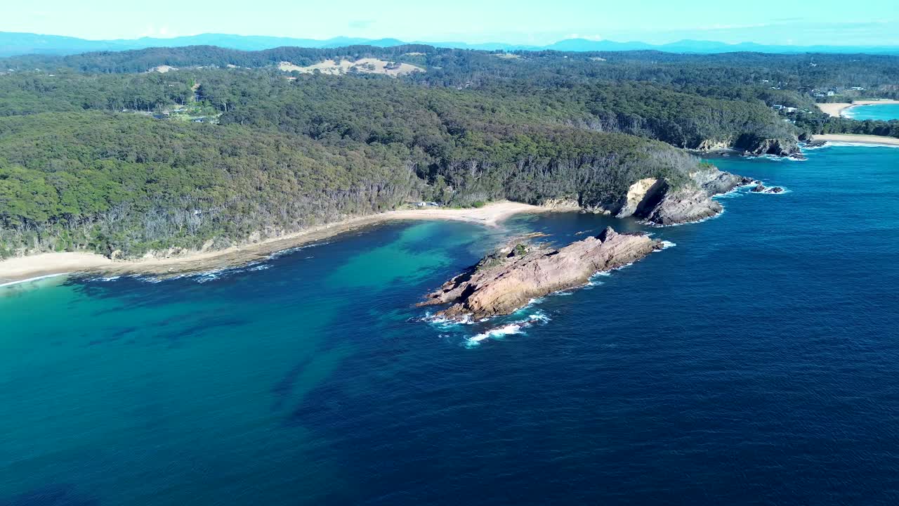 Drone aerial pan ocean sea rock headland snorkel bushland beach swimming diving spot Guerilla Bay Batemans Bay NSW South Coast travel tourism Australia 4K