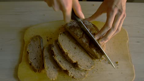 white female cutting buckwheat bread