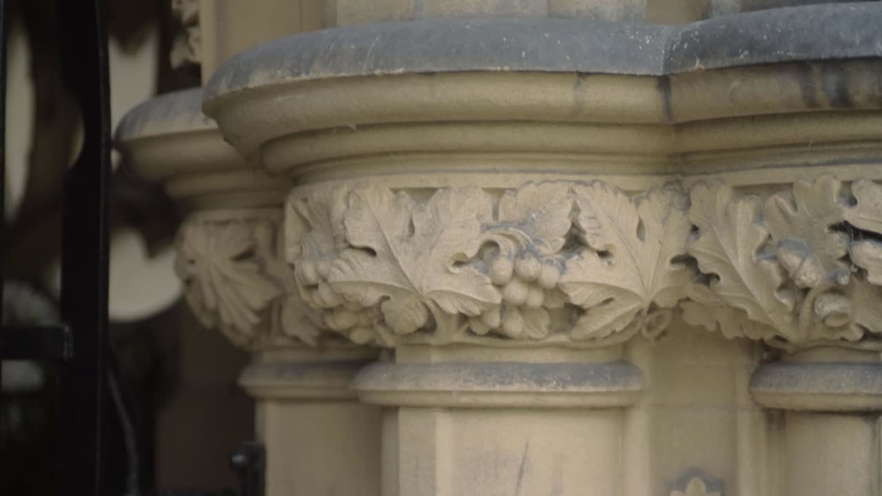 Ornate carved stone pillars at church entrance