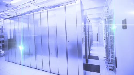 computer servers in a server room with glowing lights