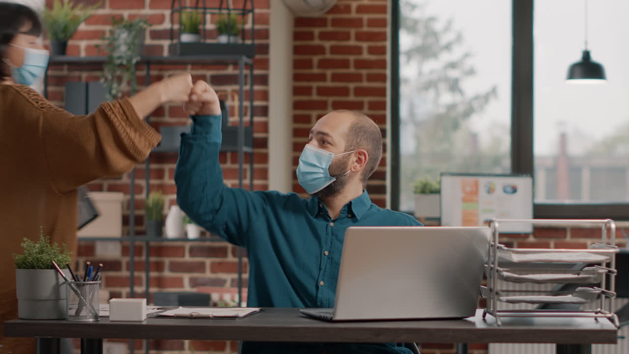 Office worker wearing a mask at work