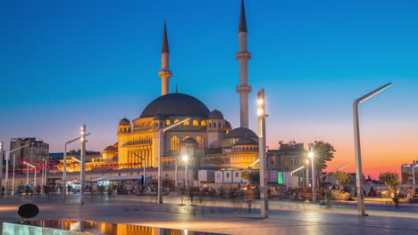 sunset timelapse taksim cami mosque on taksim square, istanbul, turkey. istanbul, turkey - november 20, 2020.