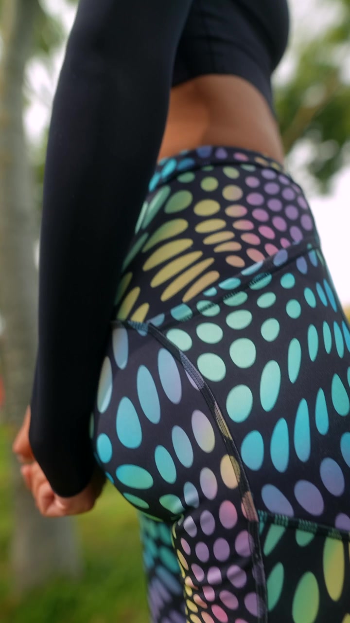Close-up of Woman Wearing Colorful Iridescent Patterned Leggings
