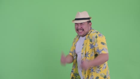 young handsome overweight asian tourist man