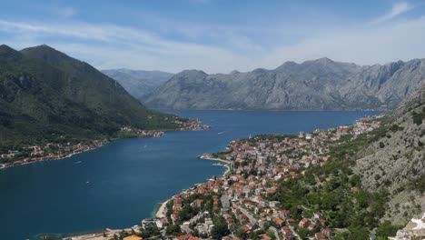 Kotor-Bay,-Cinematic-reveal-shot,-Kotor-town-and-mountains,-Montenegro