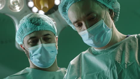 surgeons in operating room preparing for surgery
