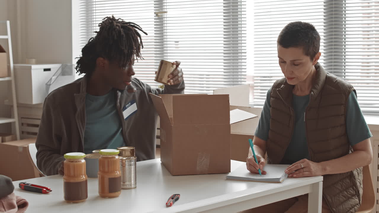 Volunteers organizing food donations at a community service event