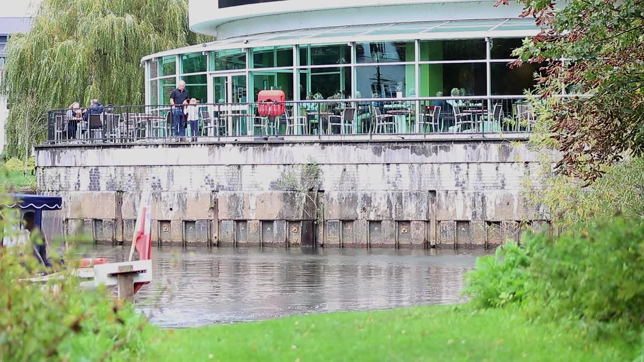Restaurant by the Canal with Boat
