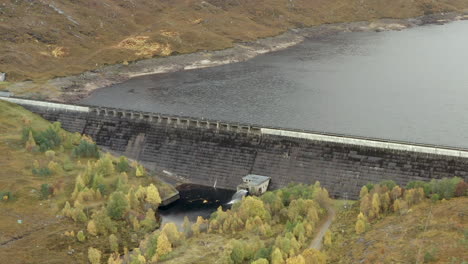 an aerial view of cluanie dam on loch cluanie in the northwest highlands of scotland at the se end of glen shiel on an overcast day