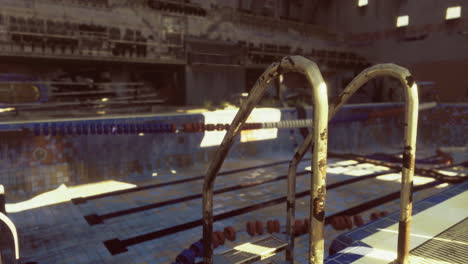 abandoned swimming pool shows signs of decay and neglect in an indoor setting