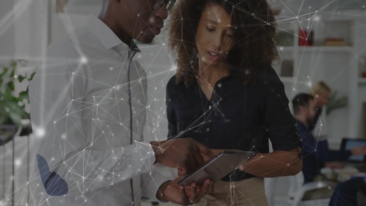 Woman tapping after man pointing tablet, reviewing content for tech, network overlay mapping links