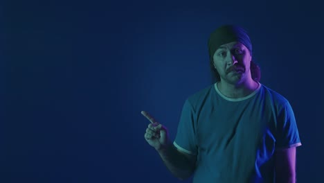man with bandana, neon lighting, expressive portrait