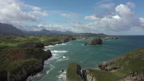 Drone-flying-over-Bufones-de-Pria-coast-in-Asturias,-Spain