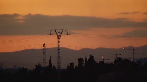 power line pylons at sunset