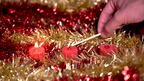 lighting of three red candles on bright gold and red backgrounds, the three wise men