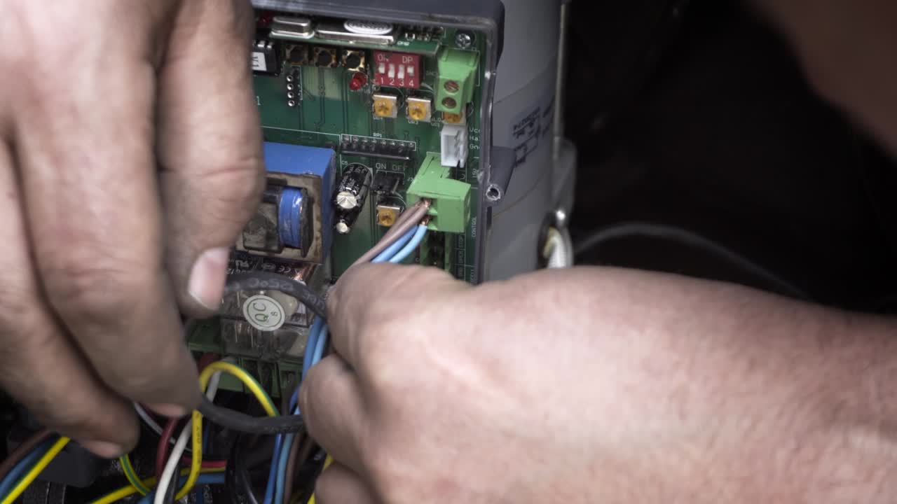 An electric automatic gate control board during repairs. An electric automatic gate control board during repairs.