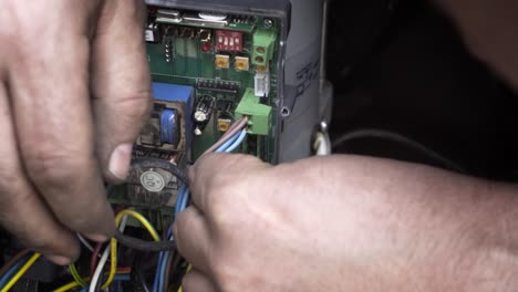 an electric automatic gate control board during repairs. an electric automatic gate control board during repairs.