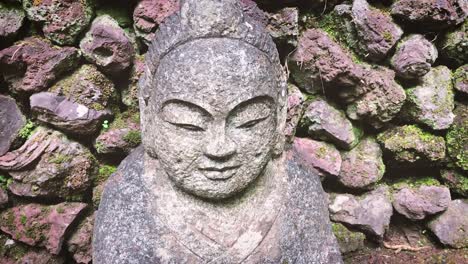 oriental style garden buddah statue made of rock or stone