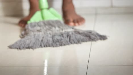 person mopping a floor