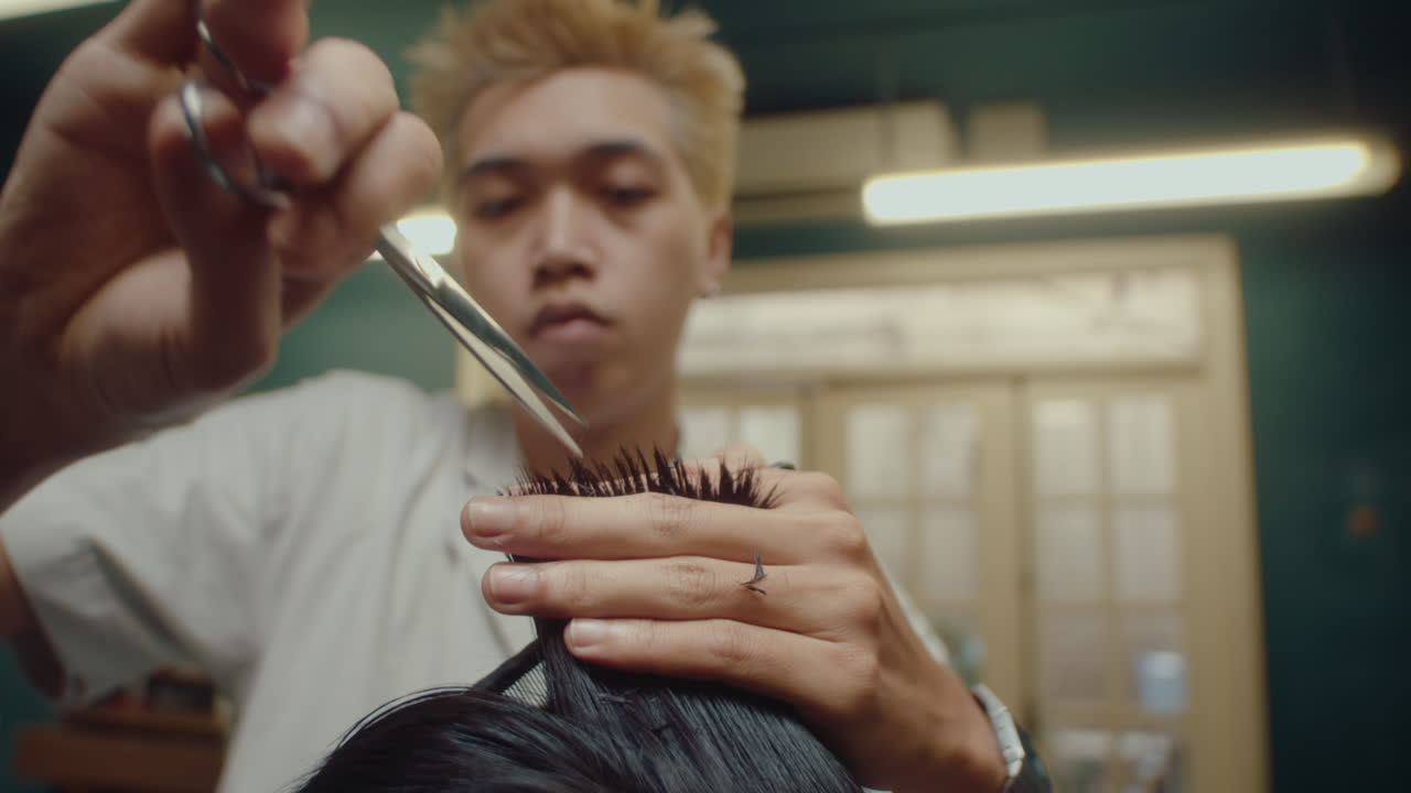 Barber Trimming Hair with Shears