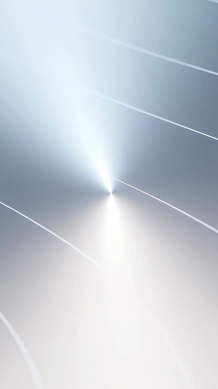 Video verticale: Punto luminoso centrale che appare e attira archi pallidi verso l'interno su un piano metallico, in loop.