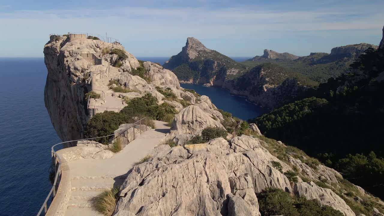 Experience breathtaking views from Mirador es Colomer in Pollensa, Mallorca. The scenic cliffs and tranquil blue waters highlight the stunning beauty of the Tramuntana mountains.