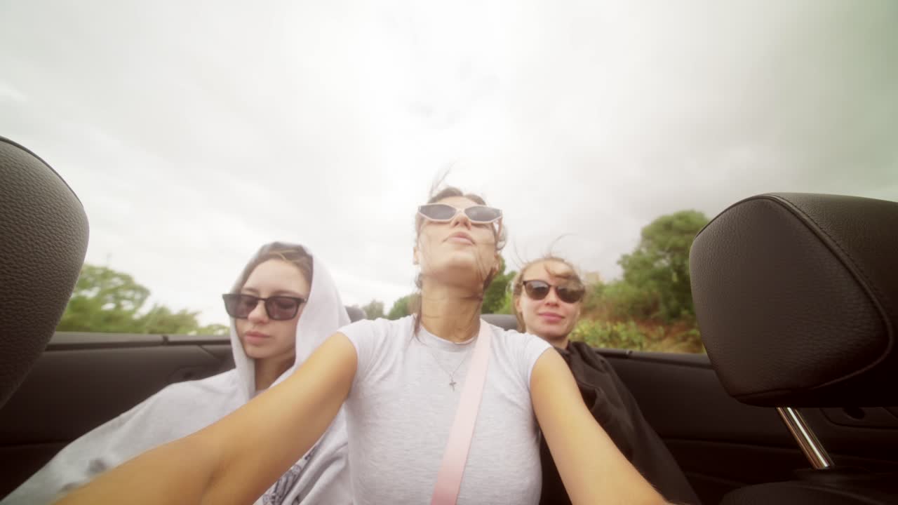 Three Girls on a Road Trip in a Convertible