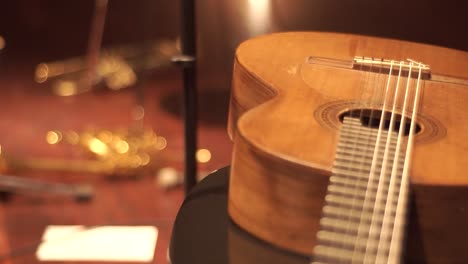 a shot displaying a classical guitar and a trumpet, utilizing a focus shifting technique