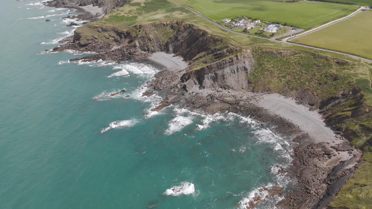 Aerial View of Rugged Coastline with Cliffs and Rocky Beaches