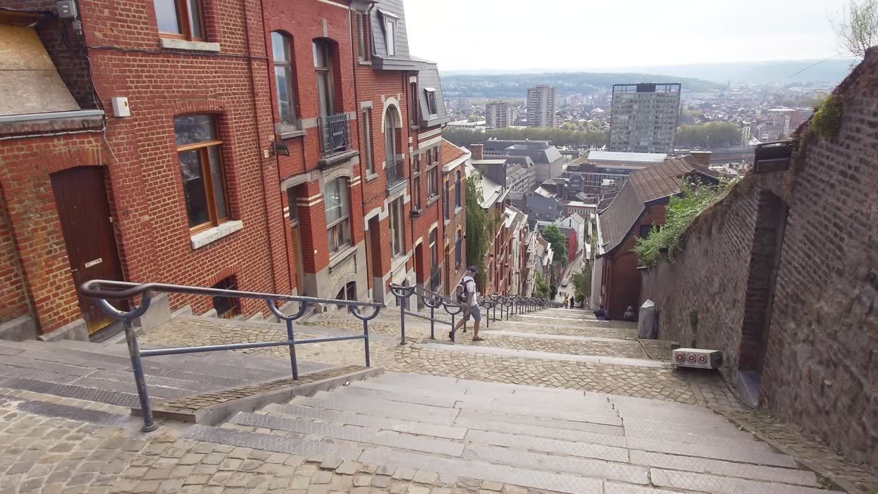 Person going down the Montagne de Bueren in Liège, Belgium. The popular stairway with 374 steps and built in 1881