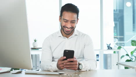 Man-laughing-while-typing-and-sending-texts-to