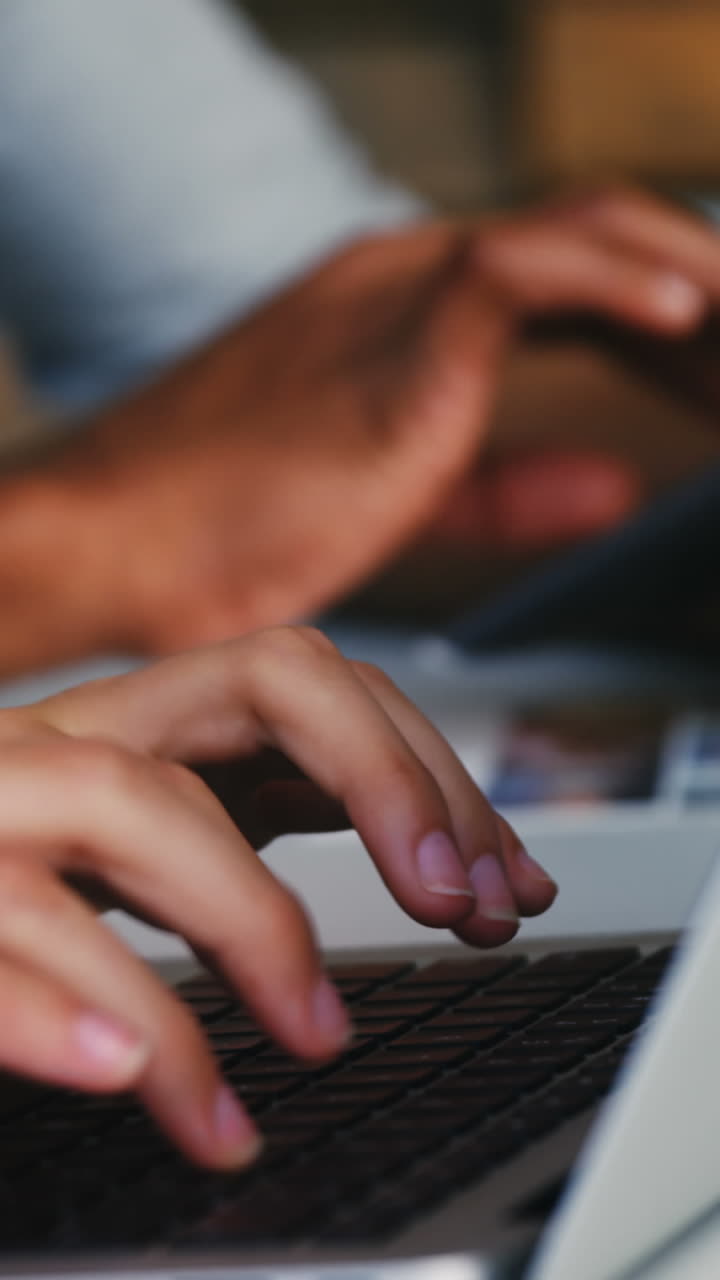 Close-up of business executives using laptop, digital tablet