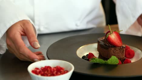 Female-cook-finishes-her-plate-presentation