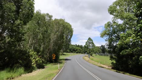 a journey along a winding road through lush landscapes