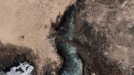 fantastic aerial shot from above to one of the caletones arches located on the island of la graciosa