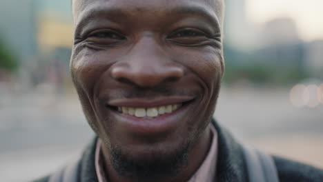 close up portrait of confident young african american businessman smiling enjoying successful lifestyle