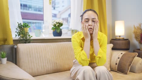 Young-woman-with-family-problems-sits-bored.