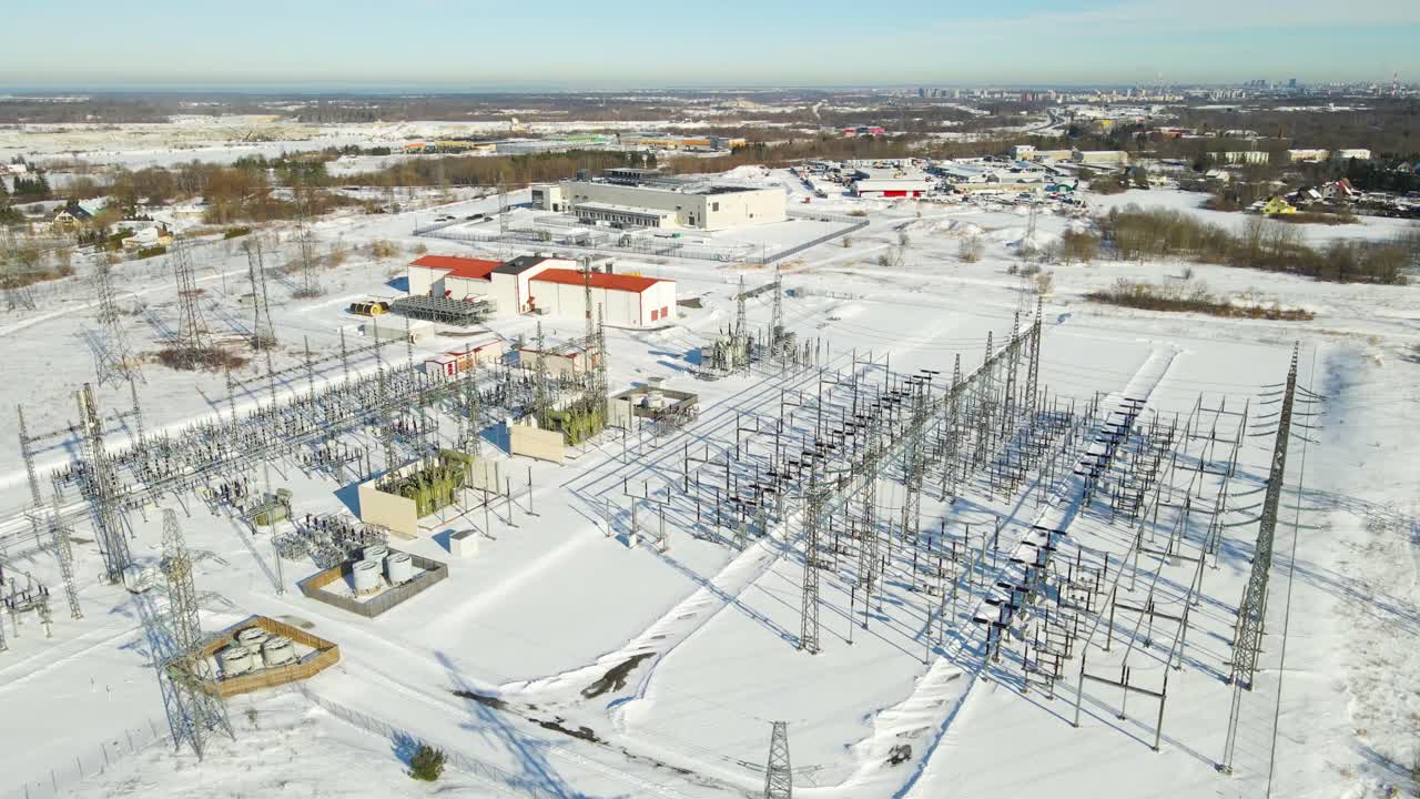 Aerial view of electrical substation supplying power to the Greenergy AI data center in Harku Estonia surrounded by snowy industrial landscape